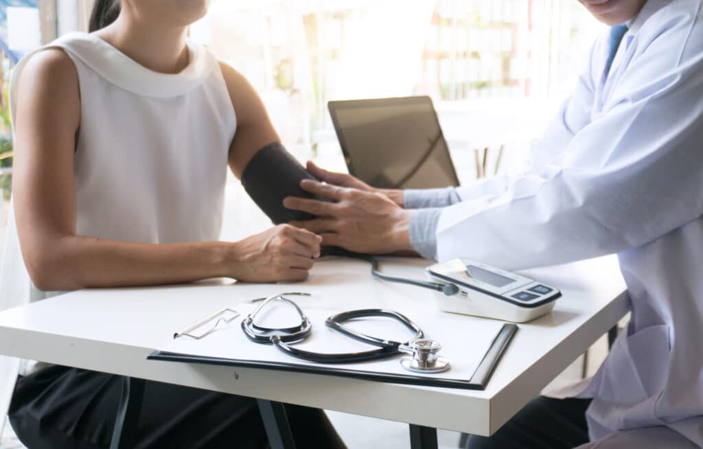 Woman getting her blood pressure tested