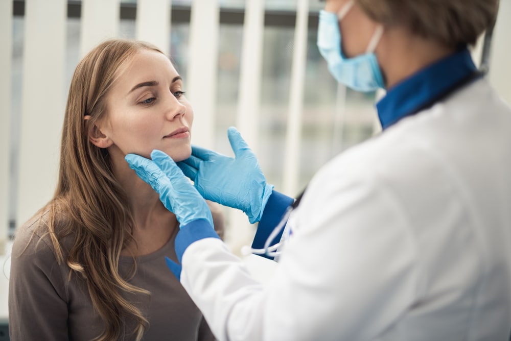 A concierge doctor in Merrifield, VA, examining a patient