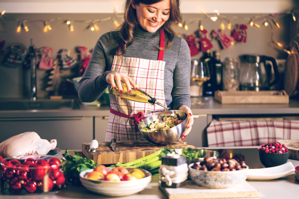 Woman prepping a healthy meal to manage diabetes during holiday gatherings