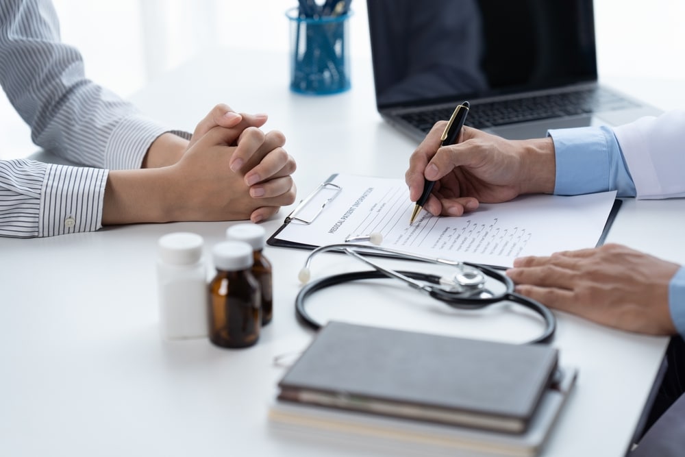 A primary care provider talking to a patient in Tysons Corner