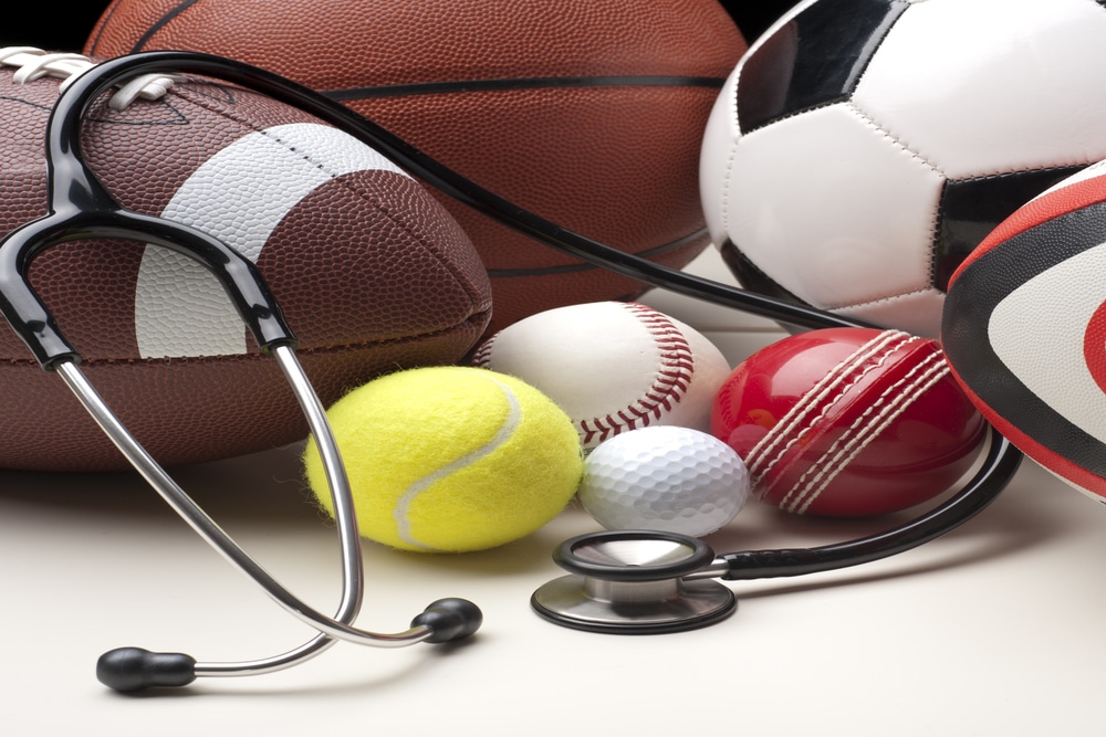 A stack of sports equipment with a stethoscope
