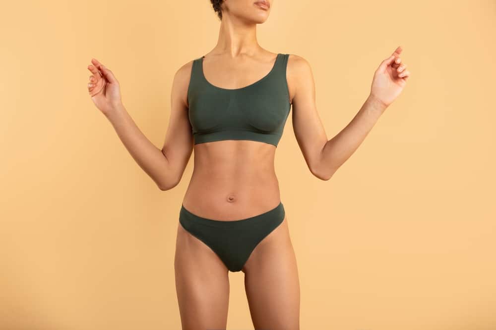 A cropped shot of a woman's torso after Emsculpt Neo in Fairfax