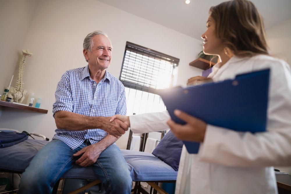 Low,Angle,View,Of,Female,Therapist,And,Senior,Male,Patient Flu Vaccination in Fairfax, South Riding, Merrifield & Tysons, VA